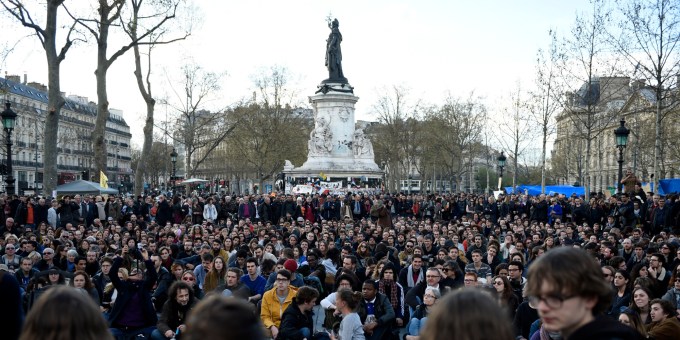 French protesters gather at Place de La Republique in Paris as part of demonstrations by the Nuit Debout (Up All Night) movement on April 12, 2016. The Nuit Debout or "Up All Night" protests began in opposition to the government's labour reforms seen as threatening workers' rights, but have since gathered a number of causes, from migrants' rights to anti-globalisation. AFP PHOTO / ERIC FEFERBERG / AFP PHOTO / ERIC FEFERBERG