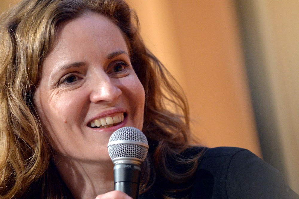 French right-wing UMP party candidate for the March 2014 mayoral elections in Paris, Nathalie Kosciusko-Morizet, smiles as she takes part in a debate at the Institute of Political Studies (IEP) or "Sciences Po" in Paris on February 13, 2014. AFP PHOTO / MIGUEL MEDINA